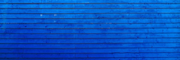 Achtergrond blauwe klassieke houten hek planken textuur in hout behang in panoramisch webformaat en header