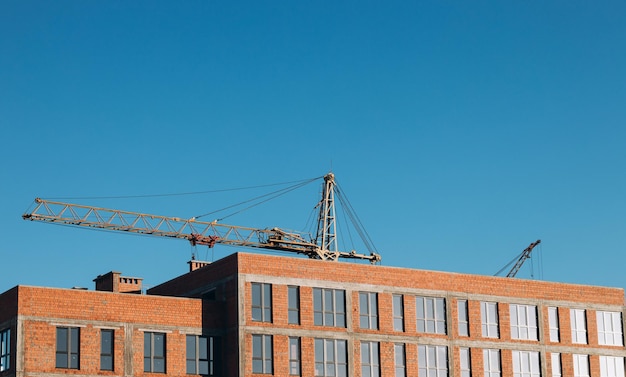 Achtergrond bouwplaats Hijskranen en nieuwe gebouwen Industriële achtergrond