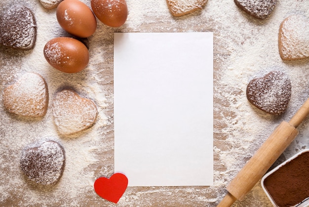 Foto achtergrond met blanco vel papier voor het recept of menu bakken