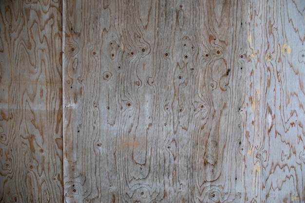 Achtergrond muur houten gevel van ruwe houten plank grijs door de tijd verouderd