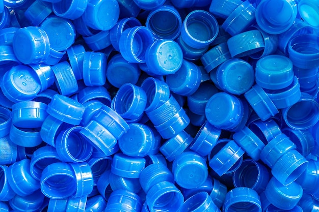 Achtergrond van blauwe plastic dop van de waterfles Veel stapels samen Sluiting