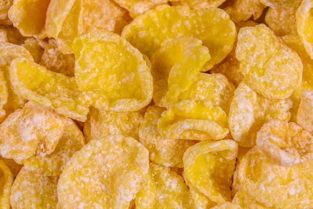 Achtergrond van de vele gele cornflakes Gezond eten