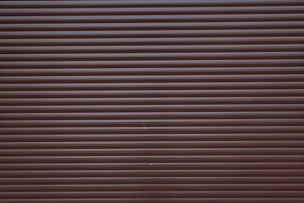 Achtergrond van het de textuurmetaal van de garagedeur de container gestripte met horizontale lijnen.