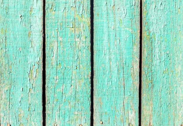 Achtergrond van oude planken met groene verf peeling