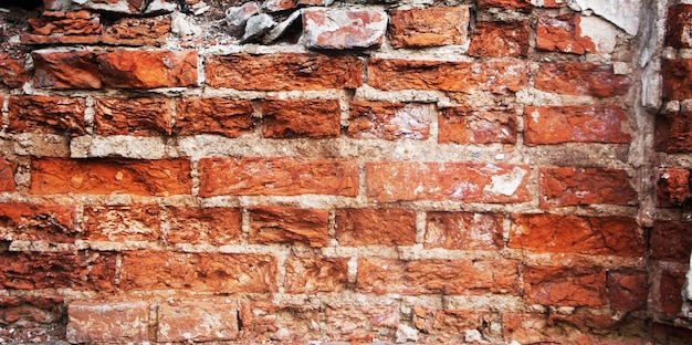 Achtergrond van oude verweerde rode bakstenen muur textuur looseup