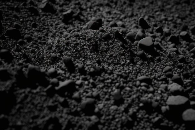 Achtergrond van ruwe korrelige steen of zand in zwart of donkergrijs