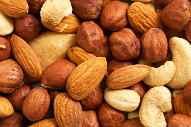 Achtergrond van verschillende soorten noten (amandel, hazelnoot, cashew, paranoot)