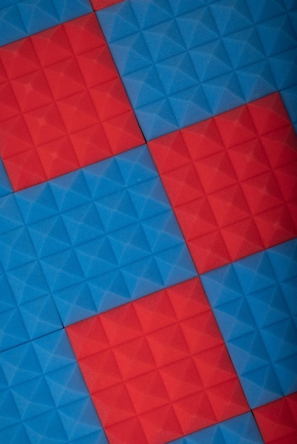 Acoustic foam panel background with red and blue lighting Music background