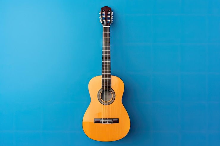 Photo acoustic guitar electric guitar over blue background