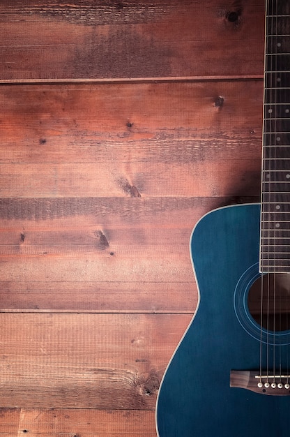 Acoustic guitar on a wooden table