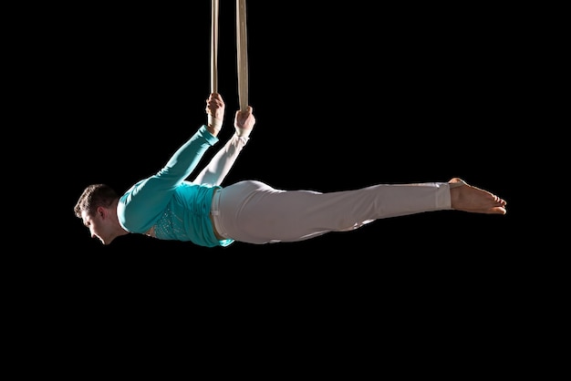 Acrobat exercise on slings