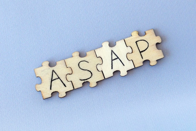 The acronym ASAP which stands for As Soon As Possible The letters written on the puzzles