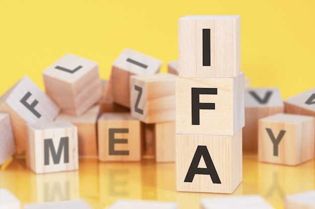 Acronym IFA from wooden blocks with letters, concept