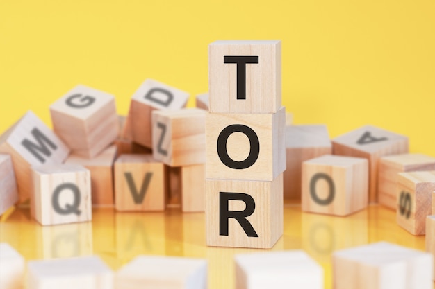 Acronym TOR from wooden blocks with letters, concept