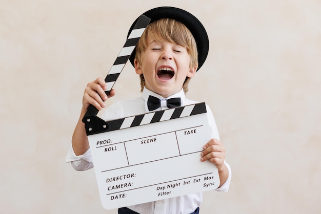 Photo action camera motor child holding clapperboard