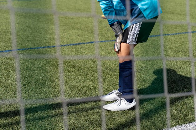 Action of soccer goalkeeper in the stadium