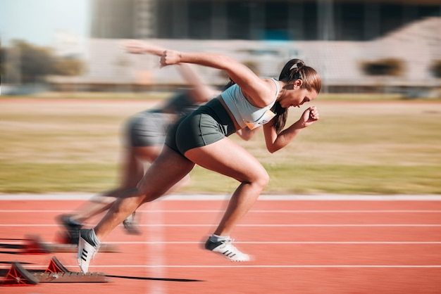Photo action speed and women athlete running sprint in competition for fitness game and training for energy wellness on a track sports stadium and athletic people or runner exercise speed and workout
