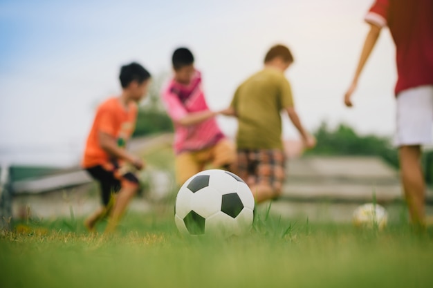 Action sport of kids playing soccer football