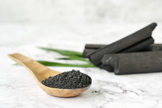 Activated charcoal powder on marble table.