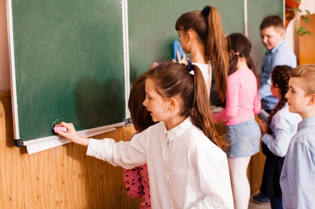 Active boys and girls have fun spending time together at school