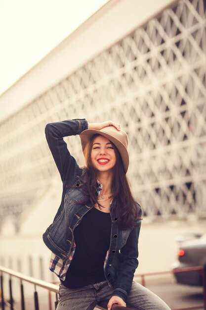 Active brunette portrait wearing a hat