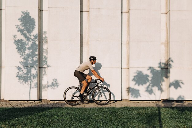 Active cyclist using black bike for workout outdoors