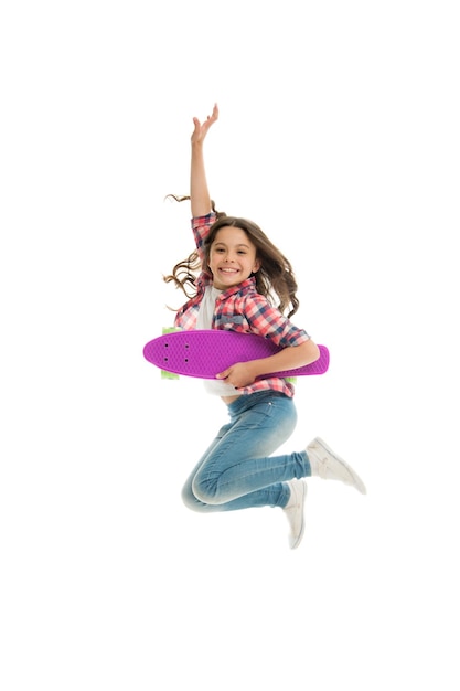 Photo active and happy kid having fun with penny board child smiling face stand skateboard penny board cute skateboard for girls lets ride girl ride penny board white background summer vacation