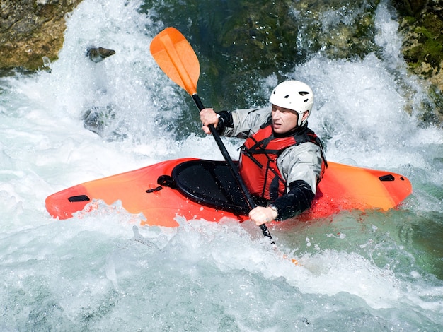 An active kayaker on the rough water