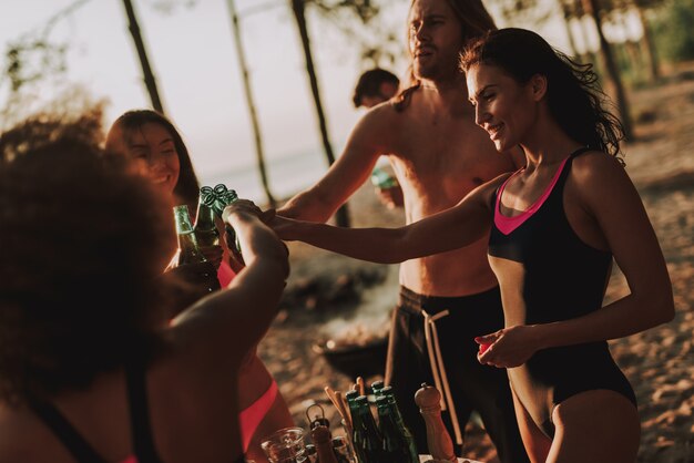 Active Lifestyle on Beach Party. Young Company Drink Beer.