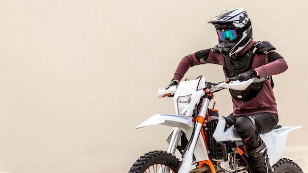 Active man riding motorbike outdoors