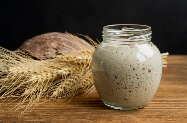 Active rye sourdough in a glass jar for homemade bread