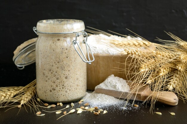 Active rye sourdough in a glass jar for homemade bread.