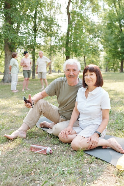 Active senior couple in park