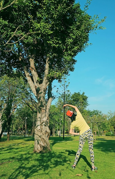 An Active Woman Stretching in the Sunshine Garden