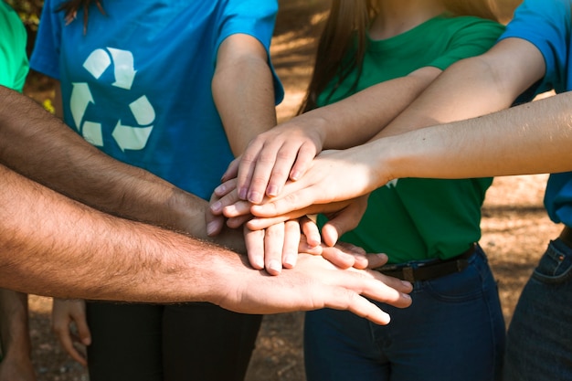 Photo activists hands together on team building