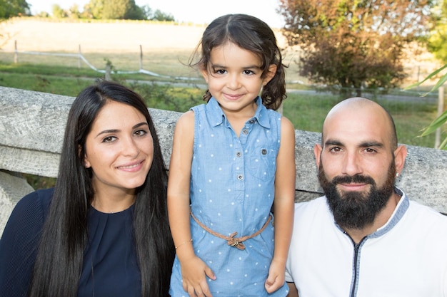 Photo activity in garden family successful concept with child daughter and two parents