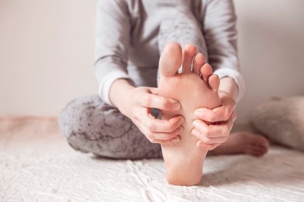 Acupressure on the feet. Foot health. 