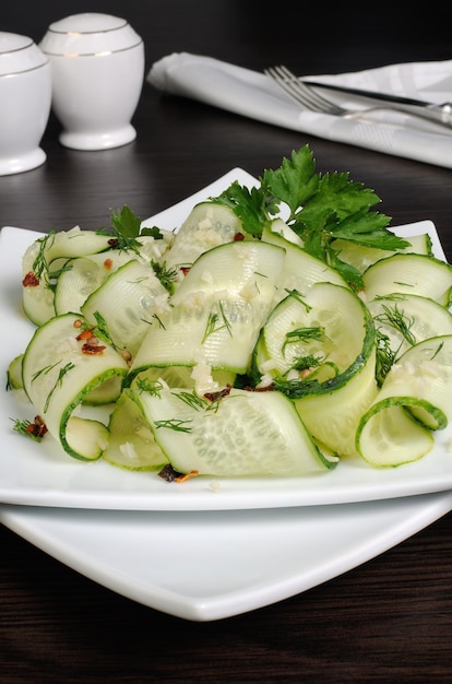 Acute appetizer of fresh cucumbers with garlic dill spices