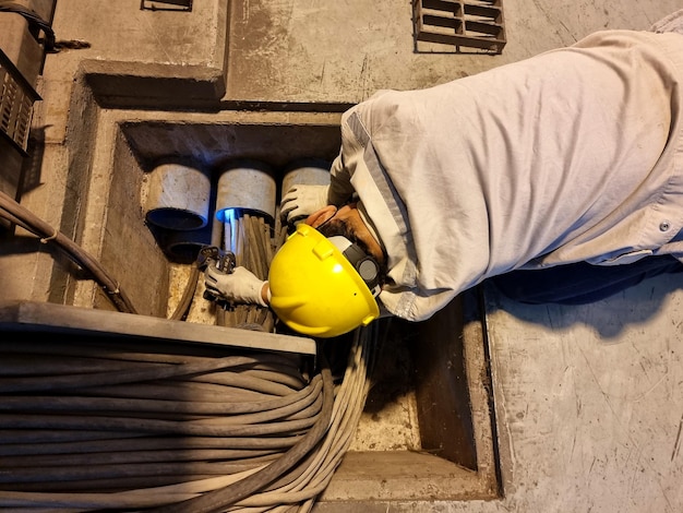 Additional cable pulling work by an electrical worker in the substation