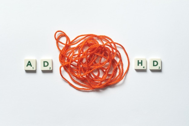 Adhd formed of scrabble blocks with tangled thread