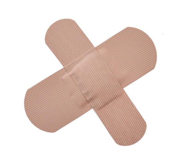 Adhesive bandage plaster or first-aid plaster isolated on white