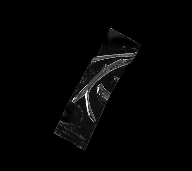 Photo adhesive plastic tape isolated on black background