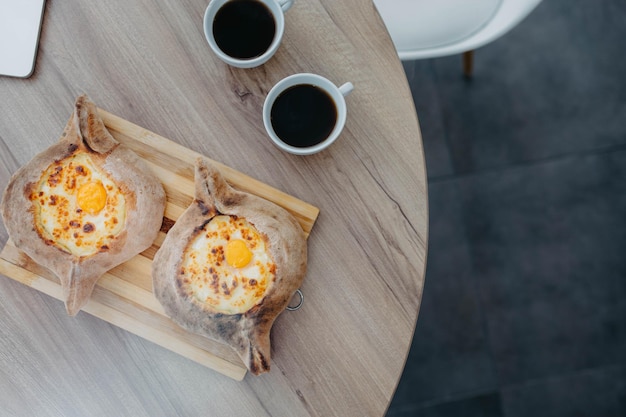 Adjarian khachapuri with cheese coffee pause business lunch