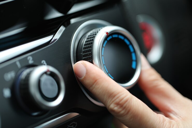Photo adjust air conditioner on dashboard in the car.