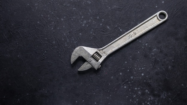 Adjustable wrench on black