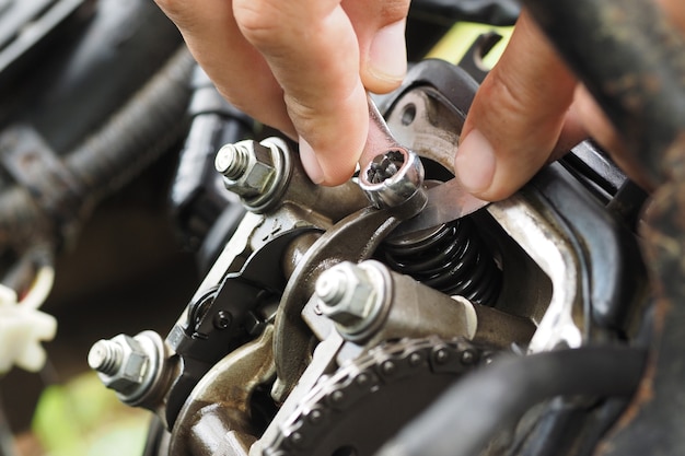 Adjusting the valves on the motor scooter.