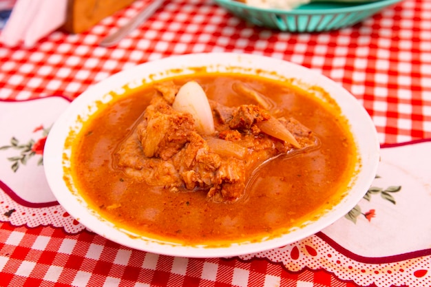 Adobo de Chancho arequipeo consists of a marinated pork meat dish