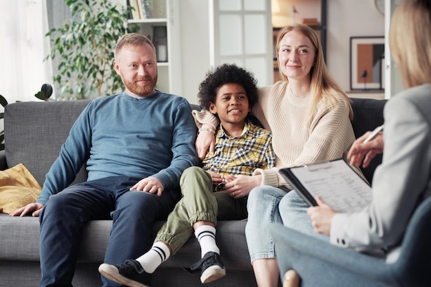 Photo adoptive family meeting with social worker