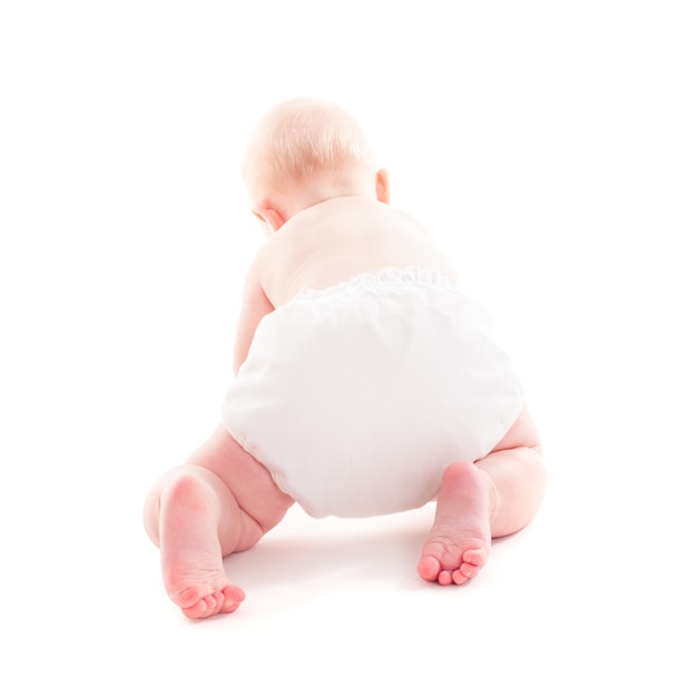 Adorable 6 month baby crawling isolated on white with copy space