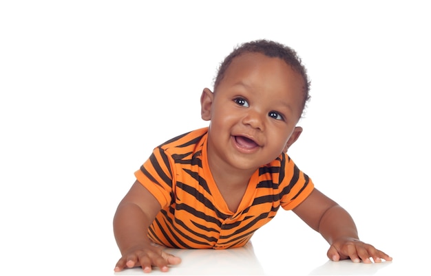 Adorable african baby lying on the floor